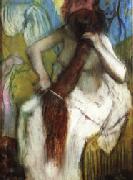 Edgar Degas Woman Combing Her Hair painting